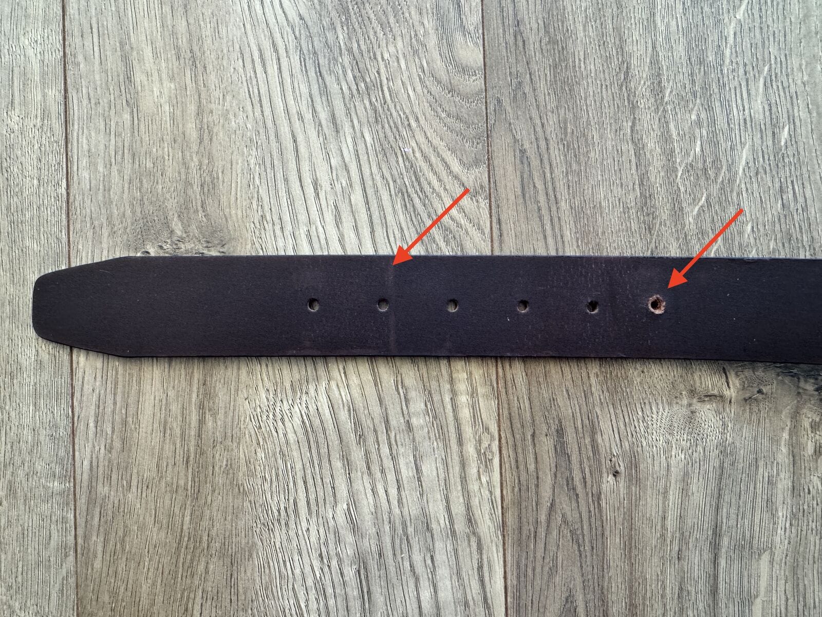 Belt showing 4 holes of progression and a new punched hole - 4 inches of waist loss